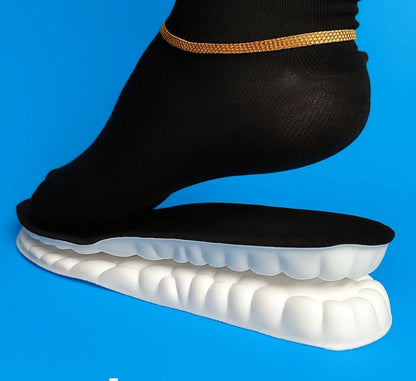 White shoe sole with black insole on a blue background