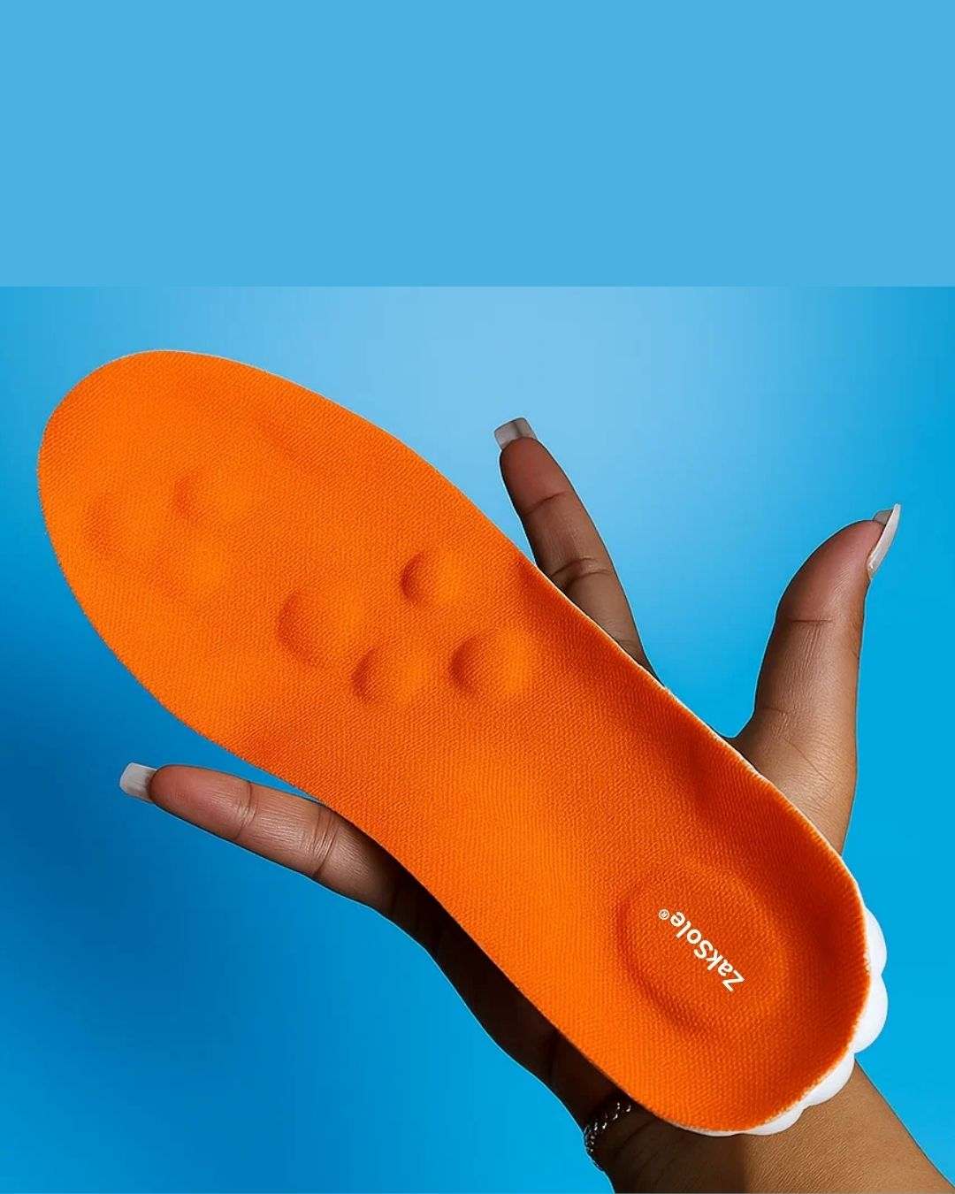 Orange insole held by a hand against a blue background